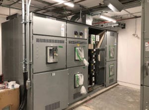 Retrofit vault and new 2000 AMP service into existing commercial building.