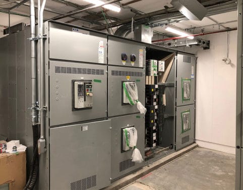 Retrofit vault and new 2000 AMP service into existing commercial building.